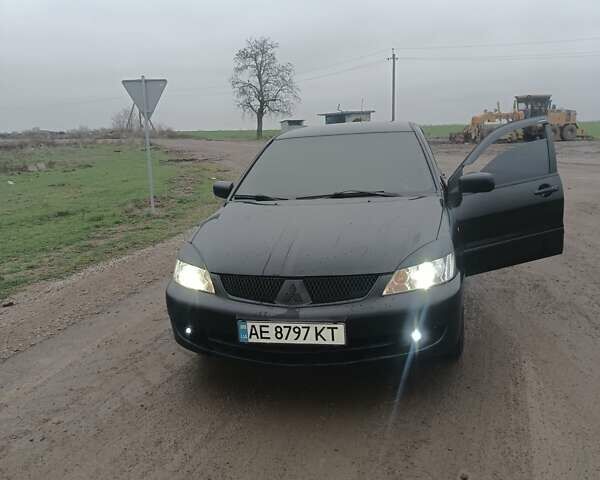 Чорний Міцубісі Lancer, об'ємом двигуна 1.58 л та пробігом 233 тис. км за 4800 $, фото 4 на Automoto.ua