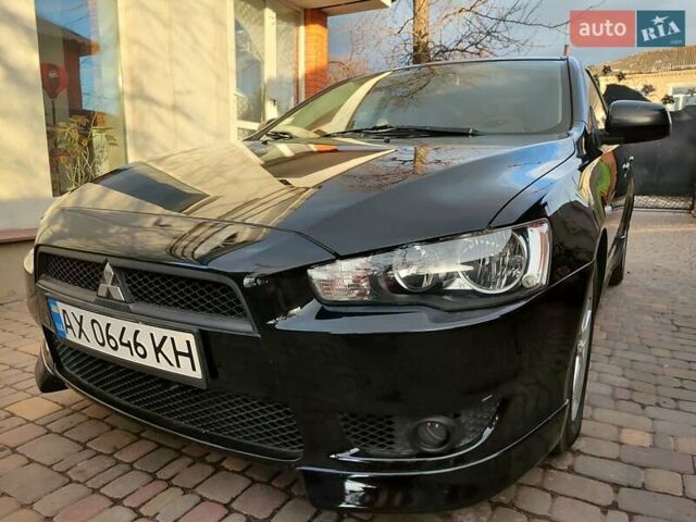 Черный Мицубиси Лансер, объемом двигателя 2 л и пробегом 162 тыс. км за 7500 $, фото 1 на Automoto.ua