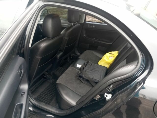 Чорний Міцубісі Lancer, об'ємом двигуна 2 л та пробігом 232 тис. км за 5000 $, фото 3 на Automoto.ua