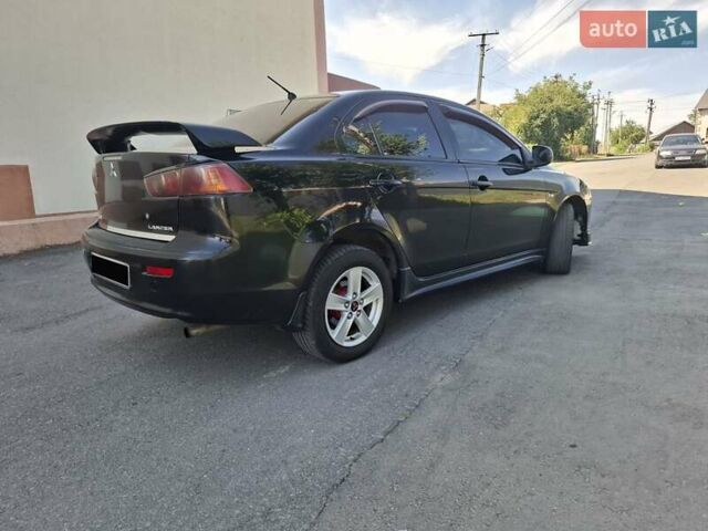 Черный Мицубиси Лансер, объемом двигателя 2 л и пробегом 230 тыс. км за 7000 $, фото 16 на Automoto.ua