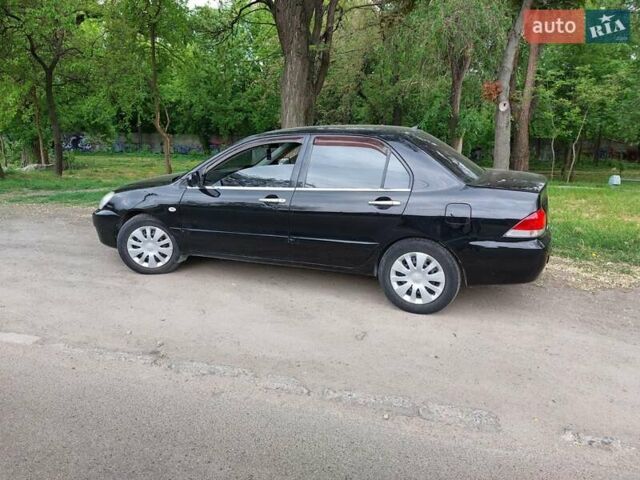 Чорний Міцубісі Lancer, об'ємом двигуна 1.6 л та пробігом 215 тис. км за 4900 $, фото 2 на Automoto.ua