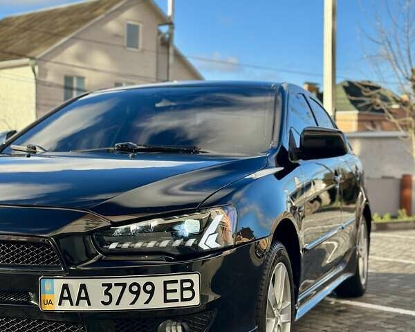 Черный Мицубиси Лансер, объемом двигателя 2 л и пробегом 150 тыс. км за 7850 $, фото 10 на Automoto.ua