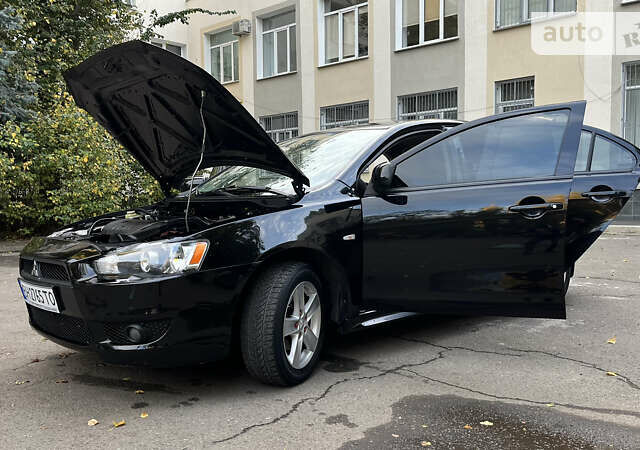 Чорний Міцубісі Lancer, об'ємом двигуна 2 л та пробігом 206 тис. км за 5600 $, фото 53 на Automoto.ua