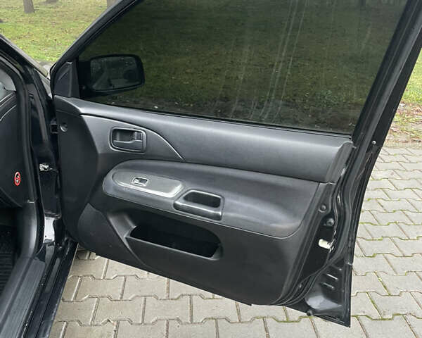 Черный Мицубиси Лансер, объемом двигателя 1.58 л и пробегом 214 тыс. км за 4400 $, фото 15 на Automoto.ua