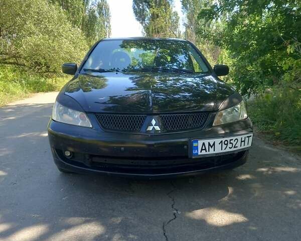 Черный Мицубиси Лансер, объемом двигателя 1.6 л и пробегом 320 тыс. км за 3800 $, фото 5 на Automoto.ua