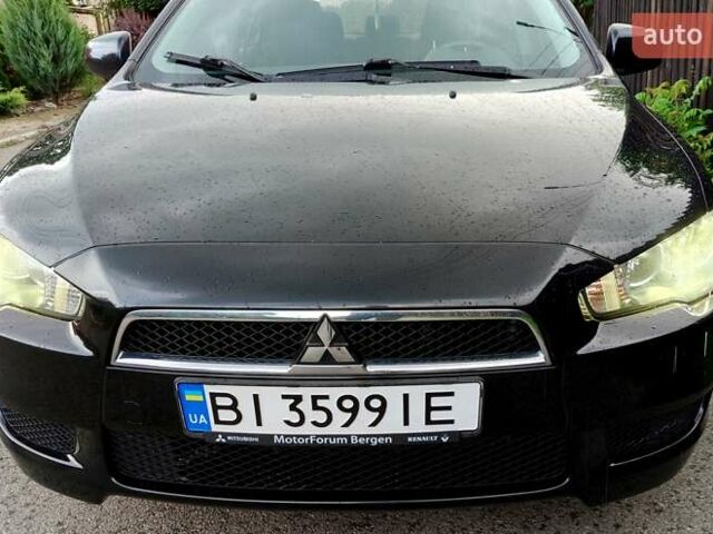 Черный Мицубиси Лансер, объемом двигателя 1.8 л и пробегом 172 тыс. км за 7100 $, фото 1 на Automoto.ua