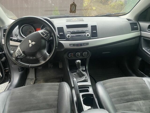 Черный Мицубиси Лансер, объемом двигателя 2 л и пробегом 190 тыс. км за 3100 $, фото 9 на Automoto.ua