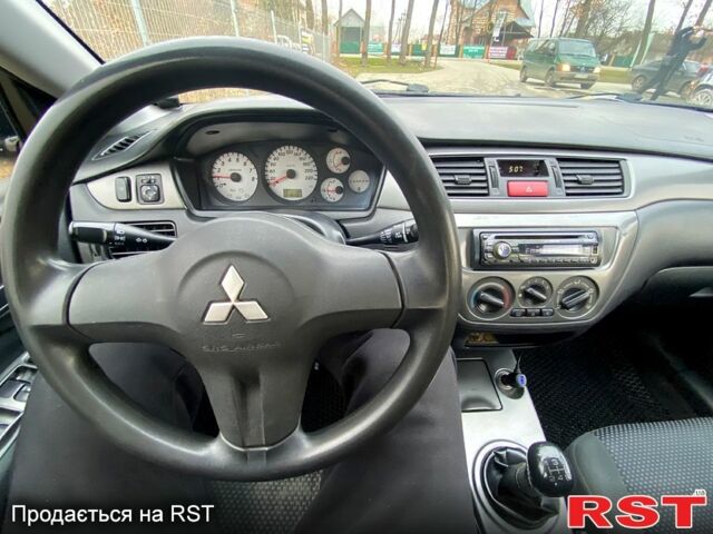 Черный Мицубиси Лансер, объемом двигателя 1.6 л и пробегом 240 тыс. км за 4200 $, фото 5 на Automoto.ua