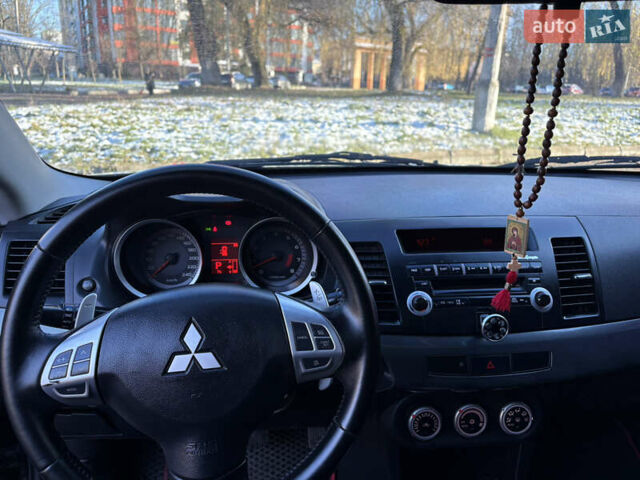 Черный Мицубиси Лансер, объемом двигателя 2 л и пробегом 236 тыс. км за 6450 $, фото 10 на Automoto.ua