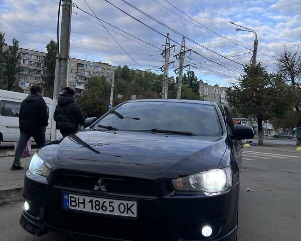 Черный Мицубиси Лансер, объемом двигателя 2 л и пробегом 222 тыс. км за 6000 $, фото 10 на Automoto.ua