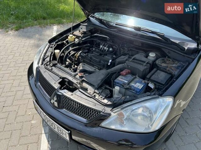 Чорний Міцубісі Lancer, об'ємом двигуна 1.6 л та пробігом 296 тис. км за 4200 $, фото 11 на Automoto.ua