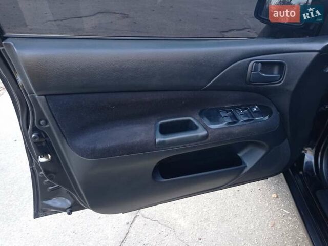 Чорний Міцубісі Lancer, об'ємом двигуна 1.58 л та пробігом 286 тис. км за 4950 $, фото 4 на Automoto.ua