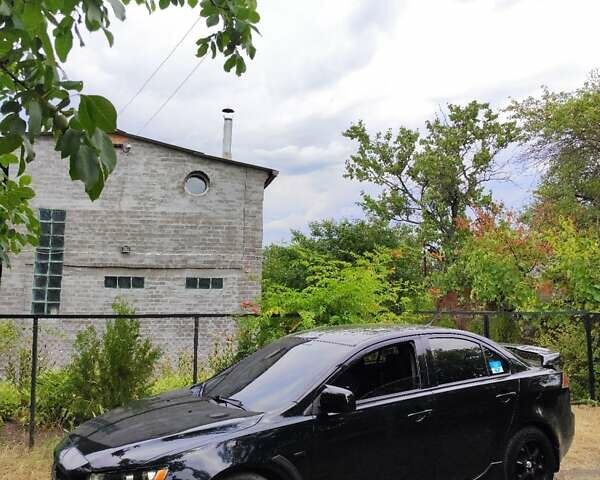 Черный Мицубиси Лансер, объемом двигателя 2 л и пробегом 220 тыс. км за 8300 $, фото 3 на Automoto.ua