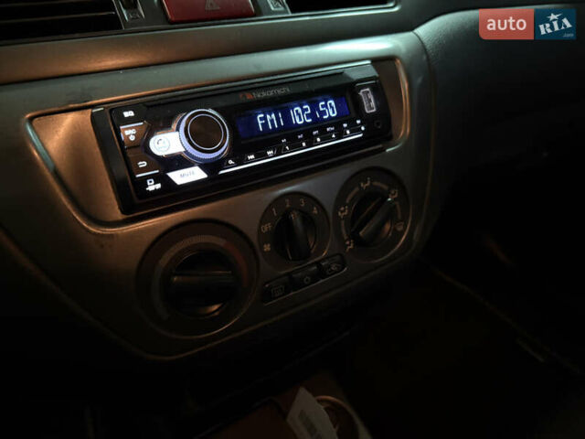 Чорний Міцубісі Lancer, об'ємом двигуна 1.58 л та пробігом 212 тис. км за 5500 $, фото 9 на Automoto.ua