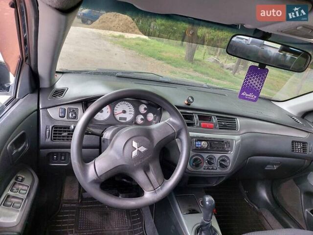 Чорний Міцубісі Lancer, об'ємом двигуна 1.6 л та пробігом 215 тис. км за 4900 $, фото 13 на Automoto.ua