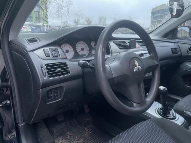 Черный Мицубиси Лансер, объемом двигателя 1.6 л и пробегом 226 тыс. км за 3750 $, фото 8 на Automoto.ua