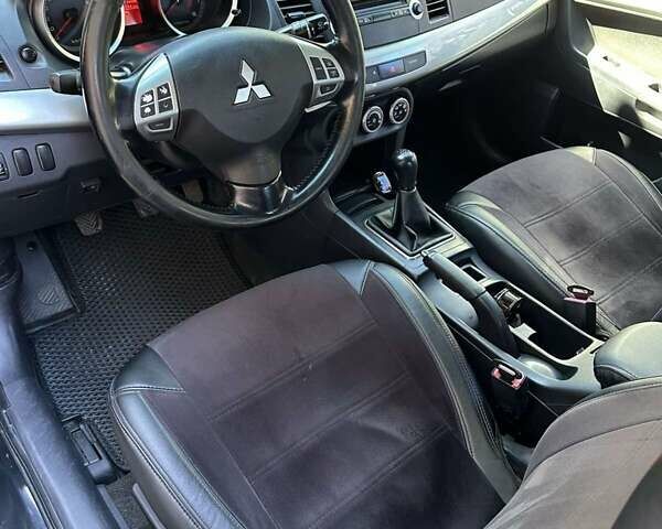 Черный Мицубиси Лансер, объемом двигателя 2 л и пробегом 230 тыс. км за 7000 $, фото 9 на Automoto.ua