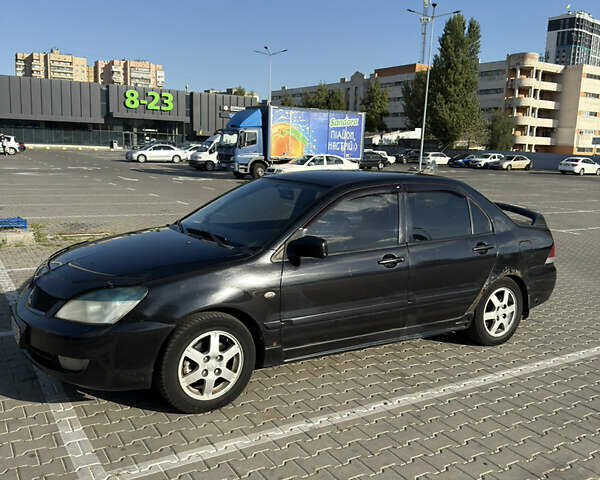 Черный Мицубиси Лансер, объемом двигателя 1.58 л и пробегом 364 тыс. км за 3000 $, фото 4 на Automoto.ua