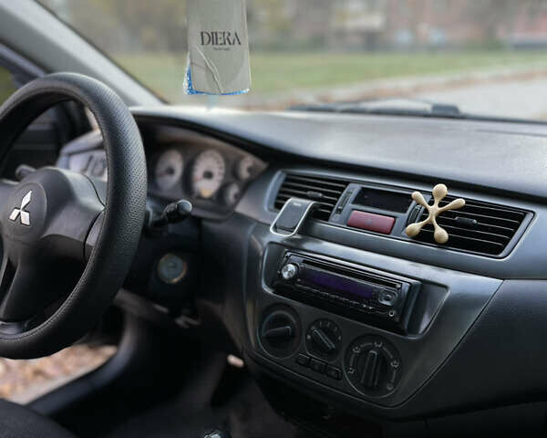 Черный Мицубиси Лансер, объемом двигателя 1.59 л и пробегом 348 тыс. км за 4200 $, фото 8 на Automoto.ua