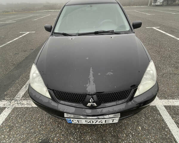 Черный Мицубиси Лансер, объемом двигателя 1.58 л и пробегом 214 тыс. км за 4400 $, фото 9 на Automoto.ua