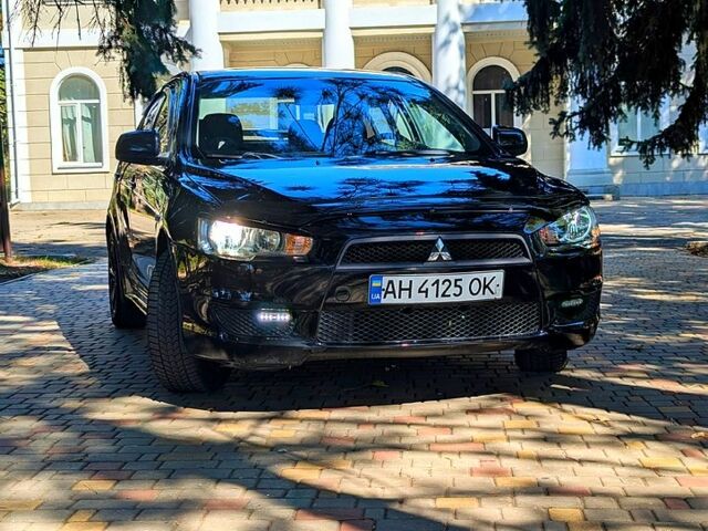 Черный Мицубиси Лансер, объемом двигателя 1.5 л и пробегом 235 тыс. км за 5250 $, фото 1 на Automoto.ua