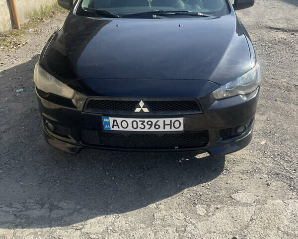 Черный Мицубиси Лансер, объемом двигателя 2 л и пробегом 300 тыс. км за 5100 $, фото 1 на Automoto.ua