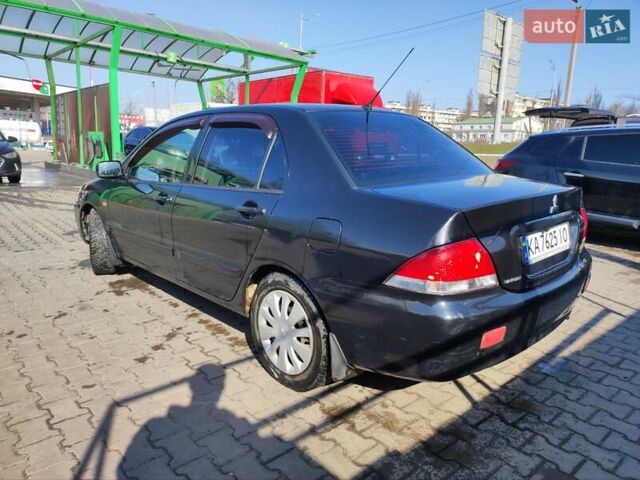 Чорний Міцубісі Lancer, об'ємом двигуна 1.6 л та пробігом 335 тис. км за 3100 $, фото 4 на Automoto.ua