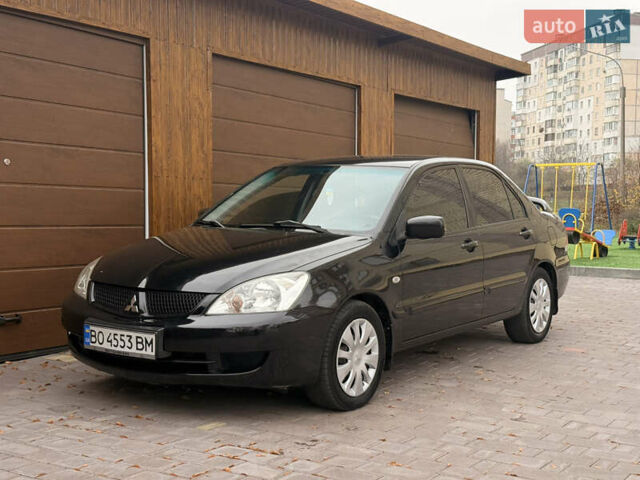 Чорний Міцубісі Lancer, об'ємом двигуна 1.6 л та пробігом 265 тис. км за 4700 $, фото 14 на Automoto.ua