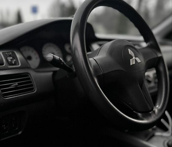 Черный Мицубиси Лансер, объемом двигателя 1.6 л и пробегом 168 тыс. км за 3700 $, фото 13 на Automoto.ua