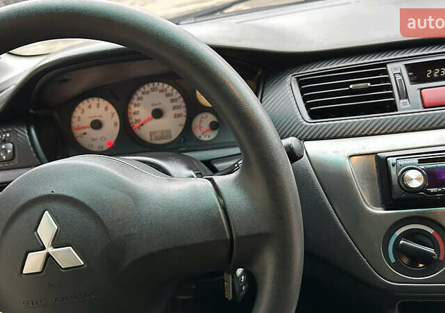 Чорний Міцубісі Lancer, об'ємом двигуна 1.58 л та пробігом 167 тис. км за 4800 $, фото 13 на Automoto.ua