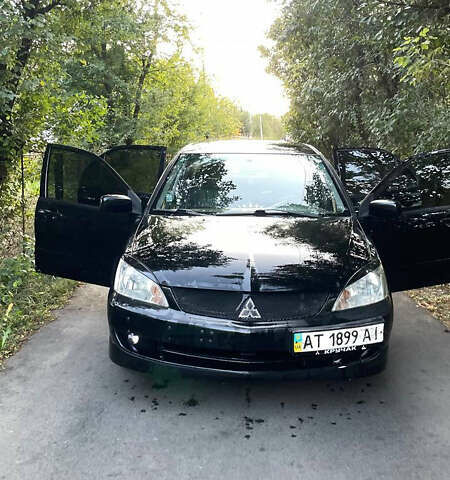Черный Мицубиси Лансер, объемом двигателя 1.58 л и пробегом 220 тыс. км за 6599 $, фото 6 на Automoto.ua