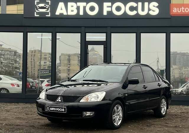 Чорний Міцубісі Lancer, об'ємом двигуна 1.6 л та пробігом 340 тис. км за 6190 $, фото 3 на Automoto.ua