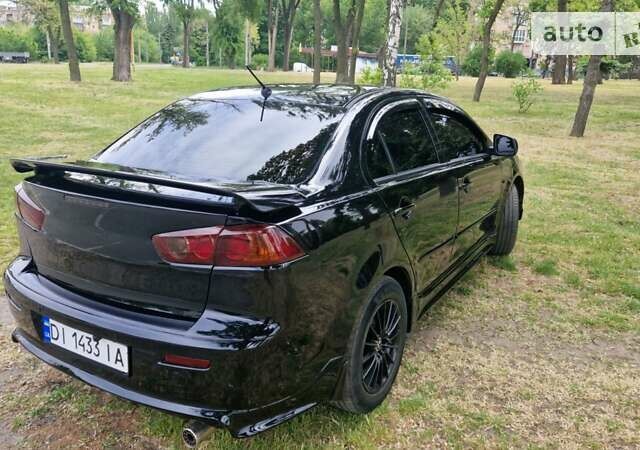 Чорний Міцубісі Lancer, об'ємом двигуна 2 л та пробігом 190 тис. км за 8000 $, фото 14 на Automoto.ua