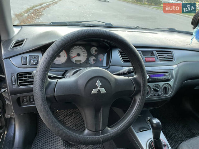 Черный Мицубиси Лансер, объемом двигателя 1.59 л и пробегом 348 тыс. км за 4200 $, фото 7 на Automoto.ua