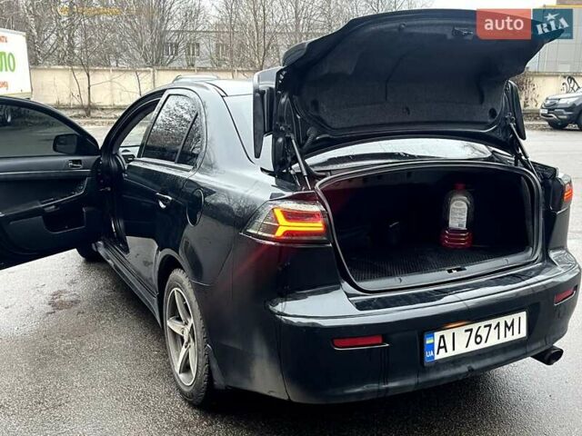 Черный Мицубиси Лансер, объемом двигателя 2 л и пробегом 217 тыс. км за 7000 $, фото 33 на Automoto.ua