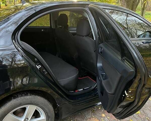 Чорний Міцубісі Lancer, об'ємом двигуна 2 л та пробігом 237 тис. км за 7500 $, фото 22 на Automoto.ua