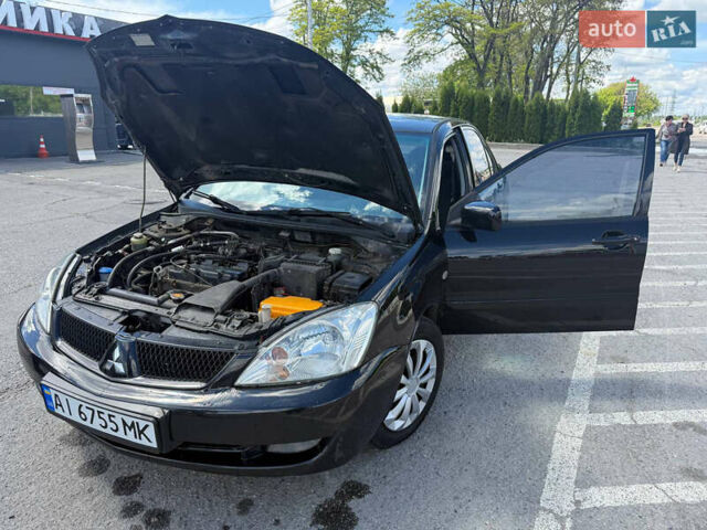 Чорний Міцубісі Lancer, об'ємом двигуна 1.6 л та пробігом 292 тис. км за 3600 $, фото 13 на Automoto.ua