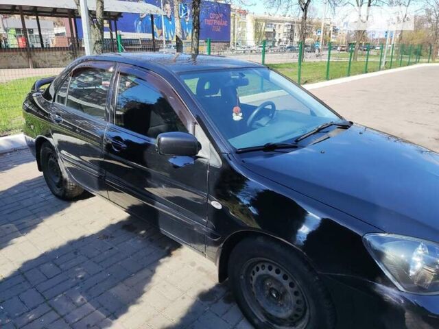 Чорний Міцубісі Lancer, об'ємом двигуна 1.58 л та пробігом 204 тис. км за 4700 $, фото 8 на Automoto.ua