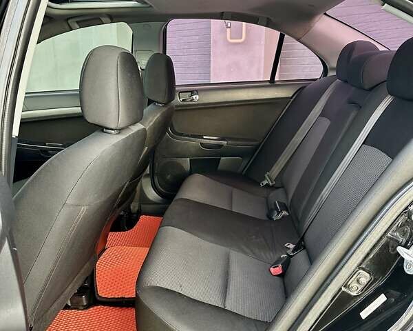 Черный Мицубиси Лансер, объемом двигателя 2 л и пробегом 150 тыс. км за 7850 $, фото 34 на Automoto.ua