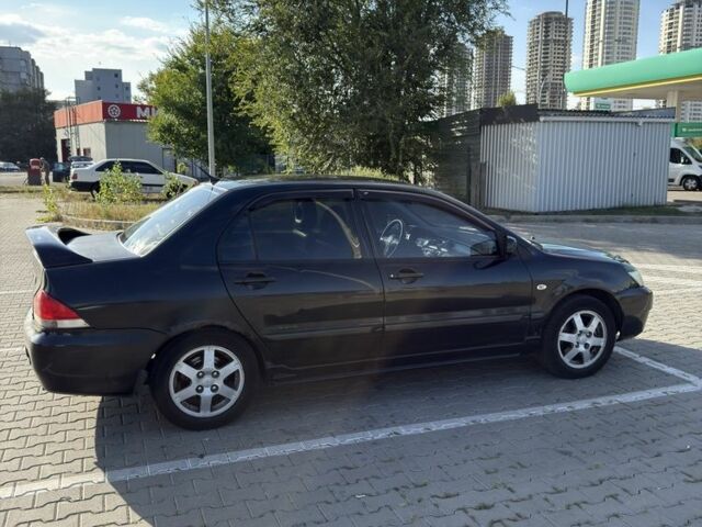 Чорний Міцубісі Lancer, об'ємом двигуна 1.6 л та пробігом 364 тис. км за 3000 $, фото 6 на Automoto.ua