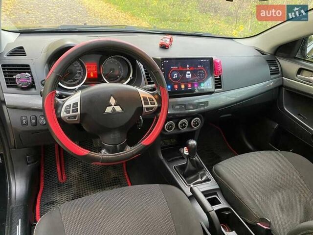 Чорний Міцубісі Lancer, об'ємом двигуна 2 л та пробігом 237 тис. км за 7500 $, фото 16 на Automoto.ua