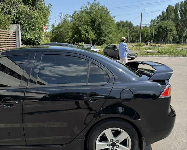 Чорний Міцубісі Lancer, об'ємом двигуна 2 л та пробігом 217 тис. км за 7800 $, фото 36 на Automoto.ua