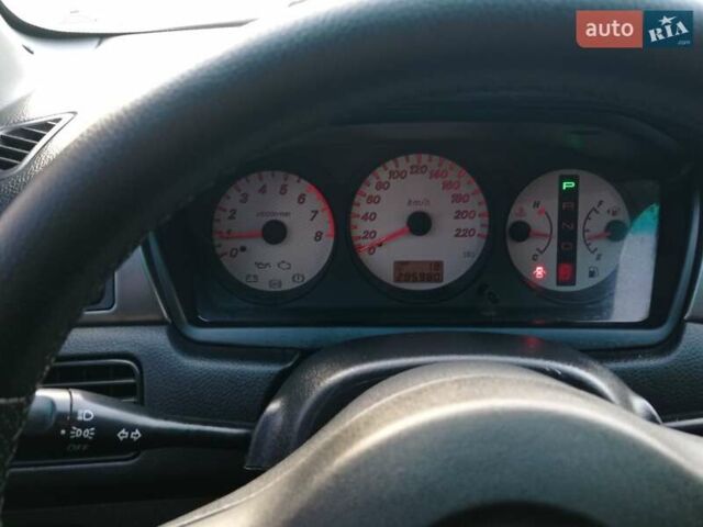 Чорний Міцубісі Lancer, об'ємом двигуна 1.58 л та пробігом 286 тис. км за 4950 $, фото 13 на Automoto.ua