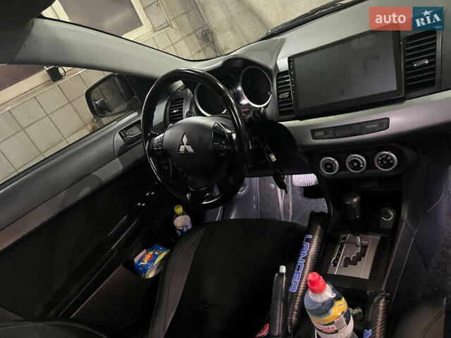 Черный Мицубиси Лансер, объемом двигателя 2 л и пробегом 200 тыс. км за 8000 $, фото 19 на Automoto.ua