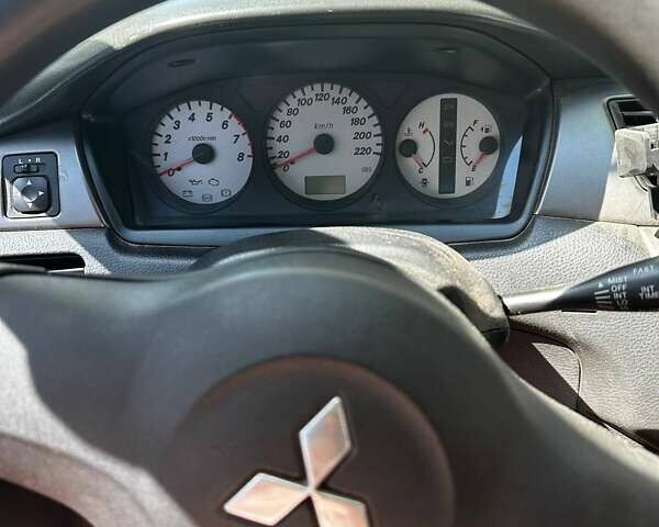 Чорний Міцубісі Lancer, об'ємом двигуна 1.6 л та пробігом 294 тис. км за 6500 $, фото 18 на Automoto.ua