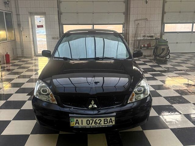 Чорний Міцубісі Lancer, об'ємом двигуна 1.6 л та пробігом 26000 тис. км за 3200 $, фото 12 на Automoto.ua