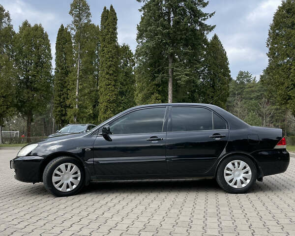Черный Мицубиси Лансер, объемом двигателя 1.6 л и пробегом 267 тыс. км за 4099 $, фото 6 на Automoto.ua