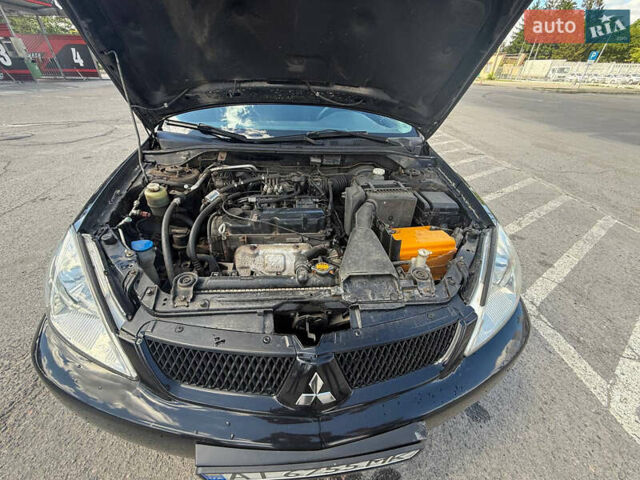 Чорний Міцубісі Lancer, об'ємом двигуна 1.6 л та пробігом 292 тис. км за 3600 $, фото 11 на Automoto.ua