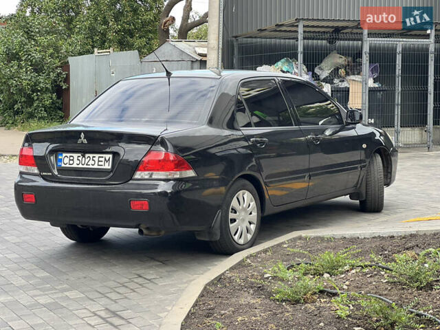 Черный Мицубиси Лансер, объемом двигателя 1.6 л и пробегом 167 тыс. км за 4850 $, фото 3 на Automoto.ua