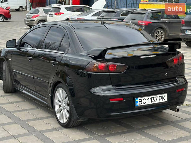 Черный Мицубиси Лансер, объемом двигателя 2 л и пробегом 236 тыс. км за 7950 $, фото 2 на Automoto.ua